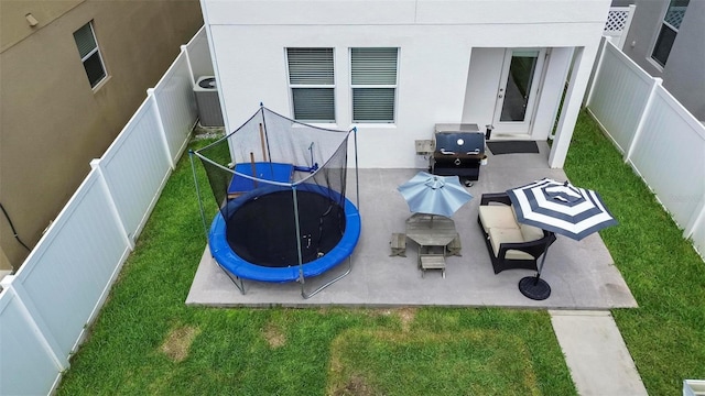 view of patio / terrace featuring a grill and a trampoline