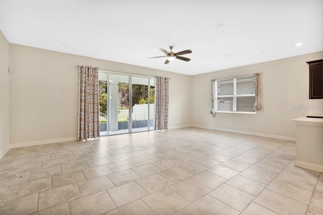 tiled empty room with ceiling fan