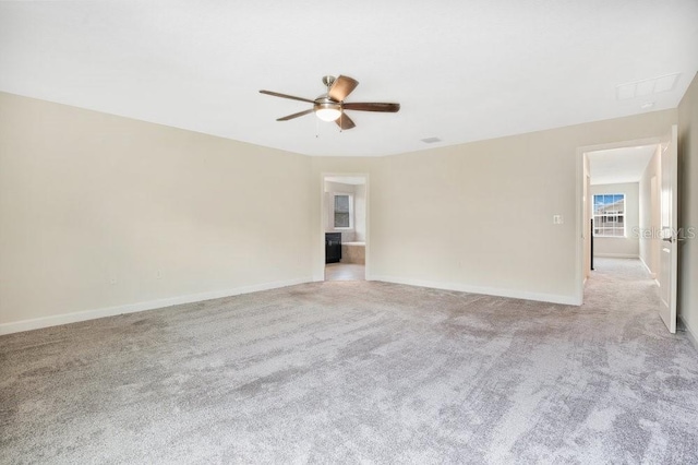 empty room featuring light carpet and ceiling fan