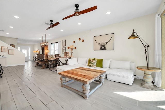living room with a ceiling fan, recessed lighting, visible vents, and wood tiled floor