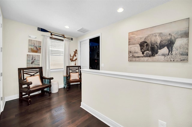 living area with dark wood finished floors, recessed lighting, baseboards, and visible vents