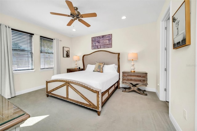 bedroom featuring light colored carpet, recessed lighting, ceiling fan, and baseboards