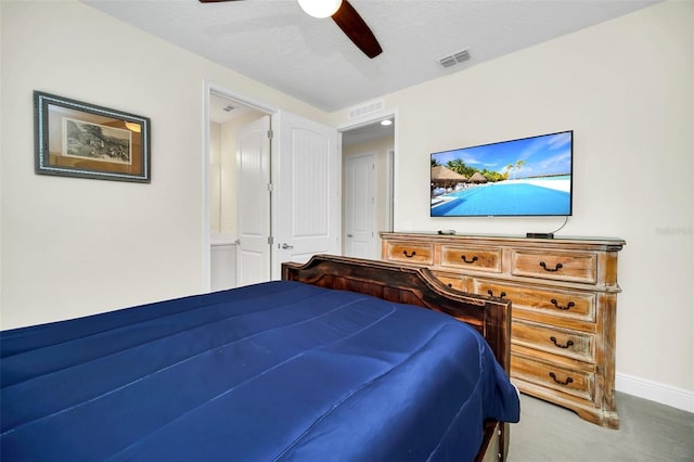 bedroom featuring carpet flooring, a textured ceiling, visible vents, baseboards, and ceiling fan