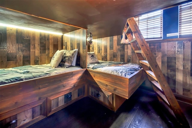 bedroom with wooden walls