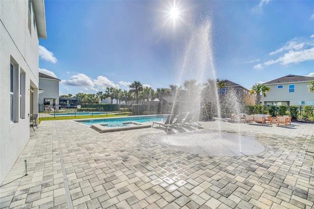 view of pool featuring a patio area and pool water feature