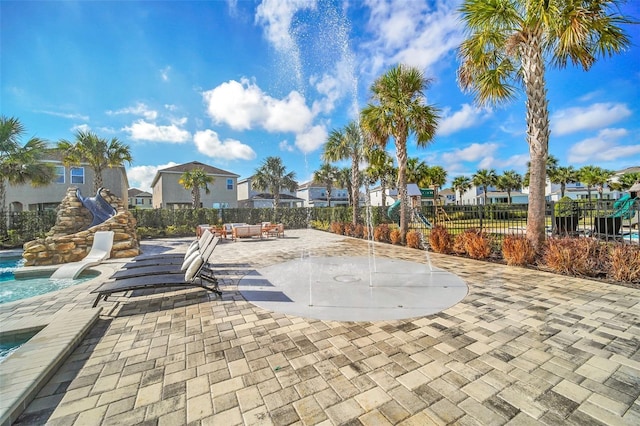 view of patio / terrace with a fenced in pool and fence