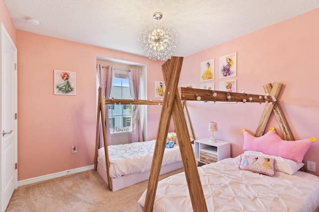 bedroom featuring light carpet, a notable chandelier, and a textured ceiling