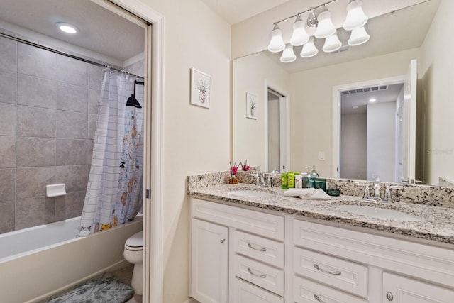 full bathroom featuring dual vanity, toilet, and shower / bath combination with curtain