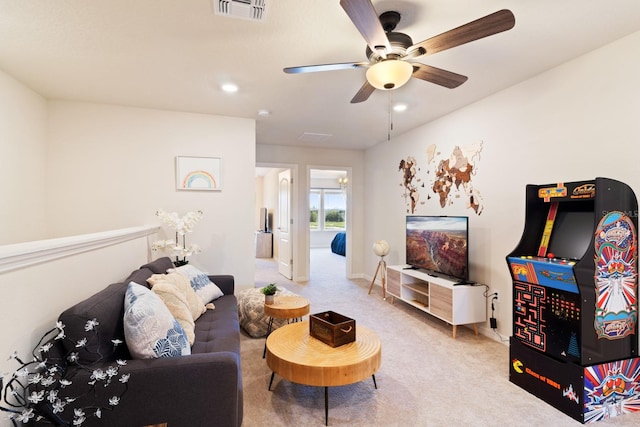 living room featuring ceiling fan and carpet flooring