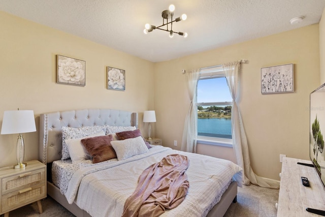 7143 Oakmoss Loop, Davenport, FL 33837 - carpeted bedroom featuring a chandelier and a textured ceiling