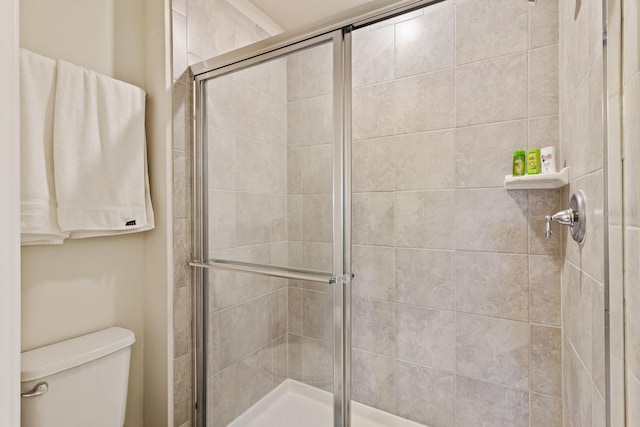 7143 Oakmoss Loop, Davenport, FL 33837 - full bathroom with toilet and a tile shower