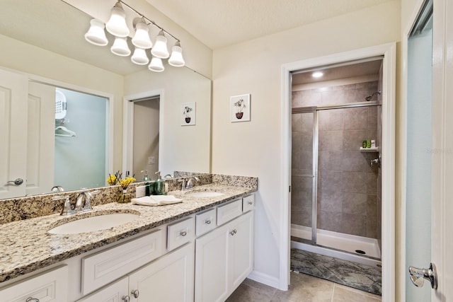 7143 Oakmoss Loop, Davenport, FL 33837 - bathroom featuring double vanity, a shower stall, and tile patterned floors