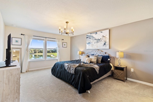7143 Oakmoss Loop, Davenport, FL 33837 - bedroom featuring light carpet, a chandelier, and baseboards