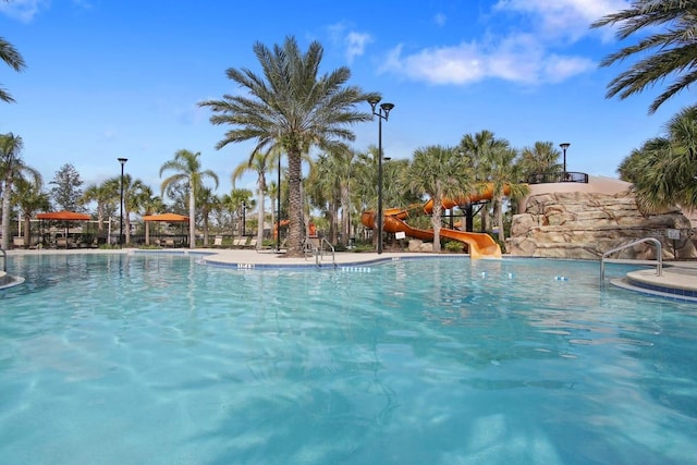 7143 Oakmoss Loop, Davenport, FL 33837 - community pool with a water slide