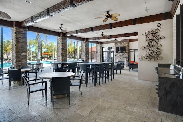 7143 Oakmoss Loop, Davenport, FL 33837 - view of patio / terrace with ceiling fan, an outdoor pool, and an outdoor bar