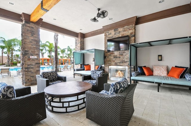 7143 Oakmoss Loop, Davenport, FL 33837 - view of patio / terrace featuring an outdoor living space with a fireplace and a community pool