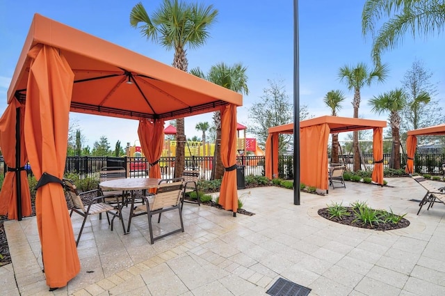 7143 Oakmoss Loop, Davenport, FL 33837 - view of patio with a gazebo and outdoor dining area