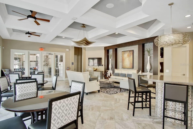 tiled dining room with beam ceiling, french doors, coffered ceiling, and ceiling fan