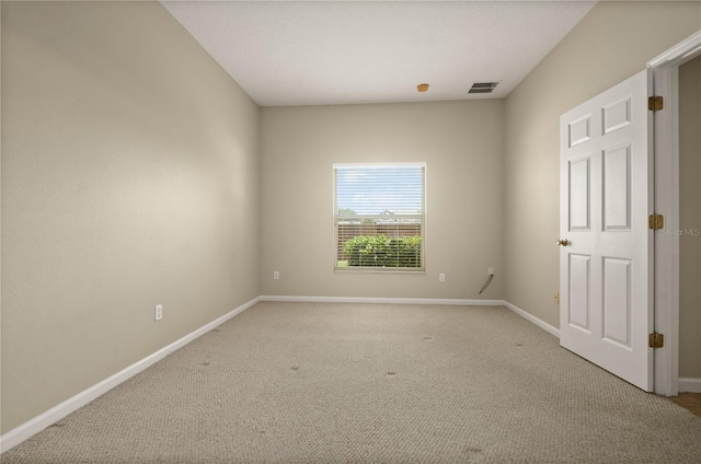 empty room featuring light colored carpet