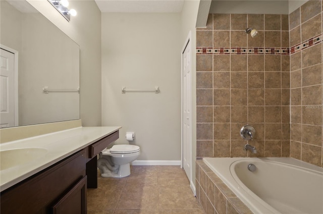 full bathroom with tiled shower / bath, vanity, toilet, and tile patterned flooring