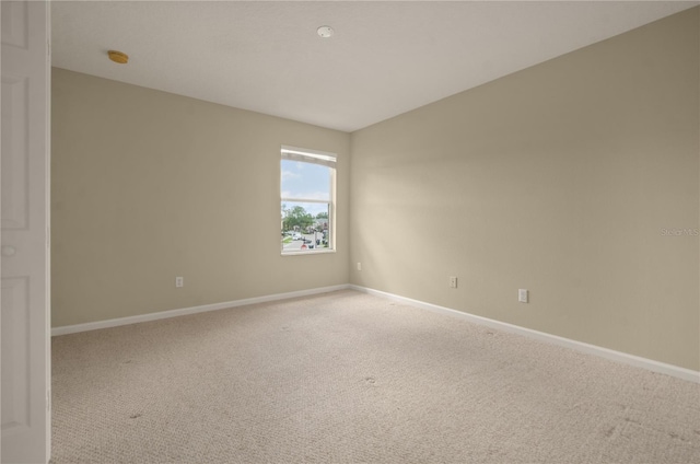 unfurnished room featuring carpet