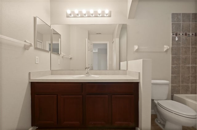 full bathroom with vanity, shower / washtub combination, and toilet