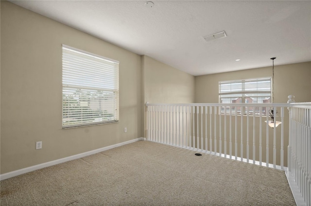 unfurnished room with carpet flooring