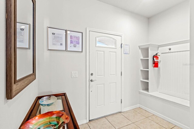 mudroom with light tile patterned flooring