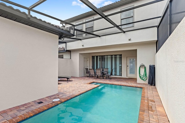 view of pool with a lanai and a patio area