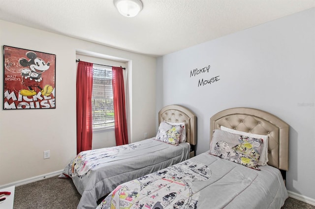 bedroom with carpet flooring and a textured ceiling