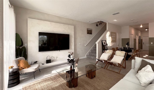 living room featuring a textured ceiling