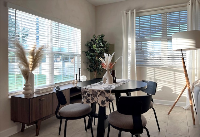 dining space with light tile patterned floors