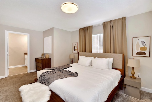 carpeted bedroom featuring connected bathroom