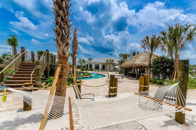 exterior space featuring a gazebo, a swimming pool, and a patio area