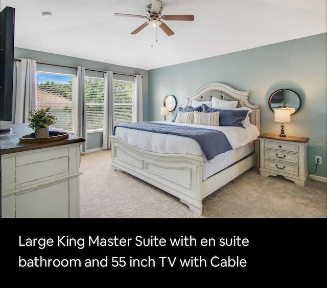 carpeted bedroom featuring ceiling fan