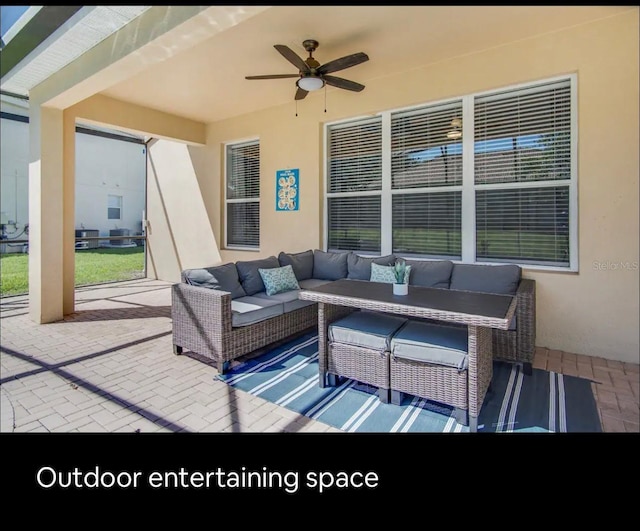 view of patio featuring an outdoor hangout area and ceiling fan