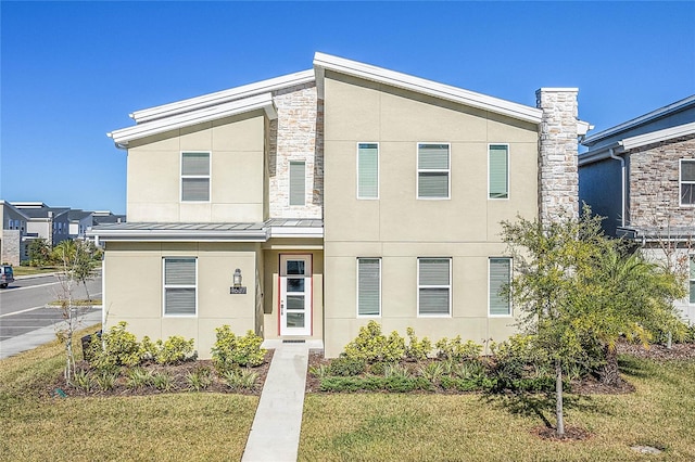 view of front of property with a front lawn