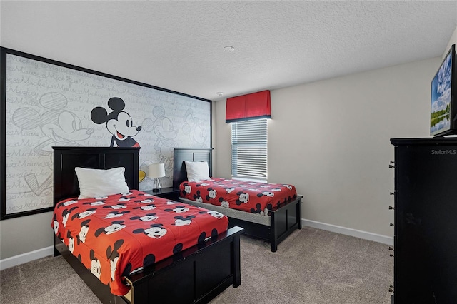 bedroom featuring light carpet and a textured ceiling