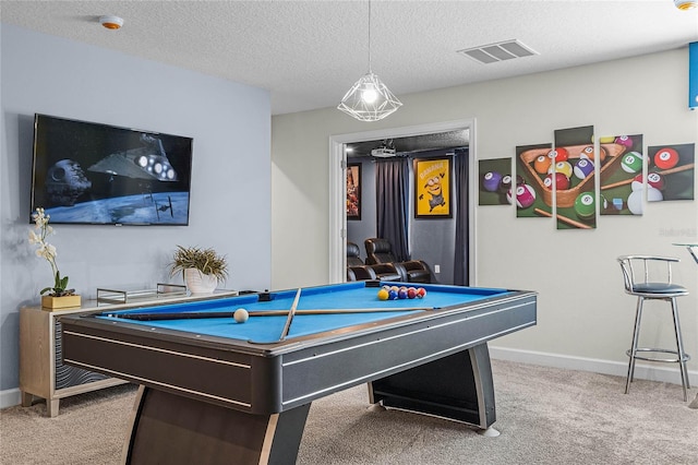 recreation room with carpet, billiards, and a textured ceiling