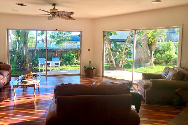 living room with ceiling fan and hardwood / wood-style floors