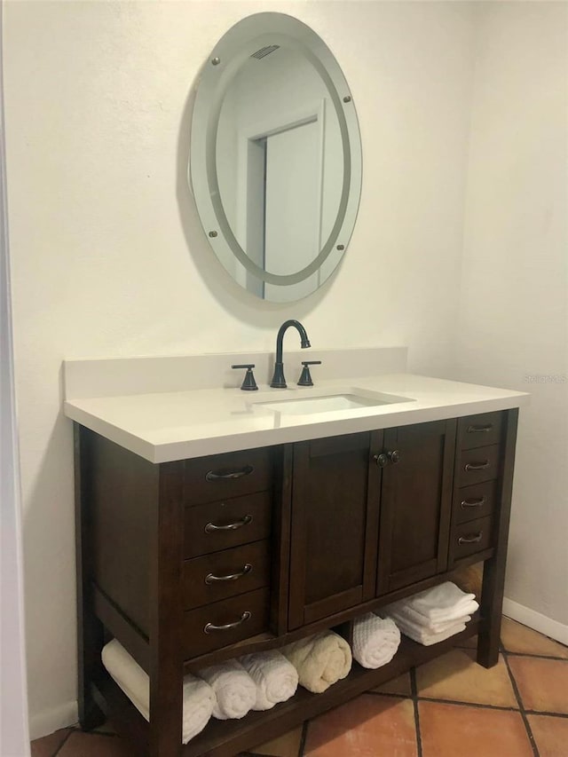 bathroom with vanity and tile patterned flooring