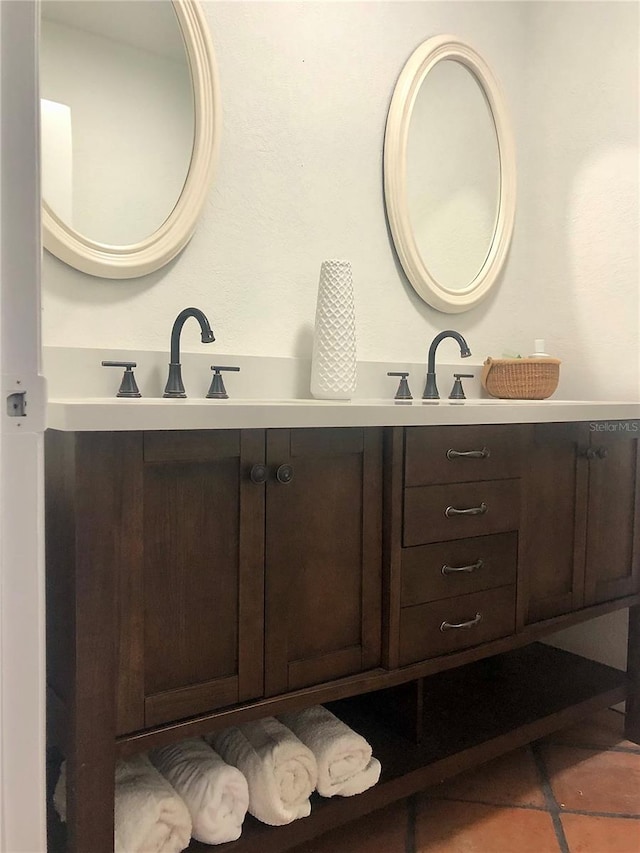 bathroom with tile patterned flooring and vanity