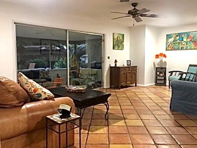 tiled living room with ceiling fan