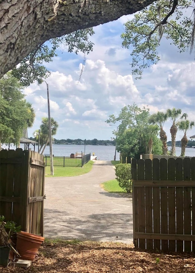 view of gate featuring a water view