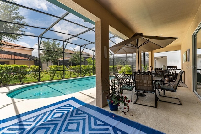 view of pool with a lanai and a patio area