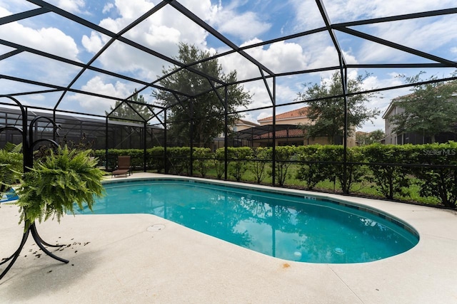 view of pool with a lanai and a patio area