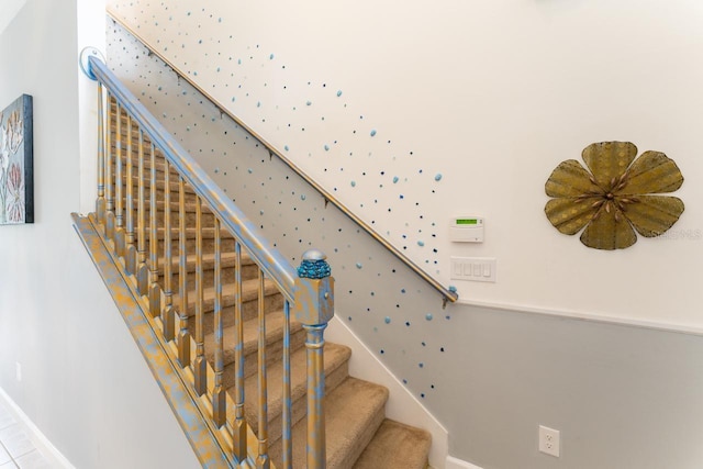 staircase featuring tile patterned floors