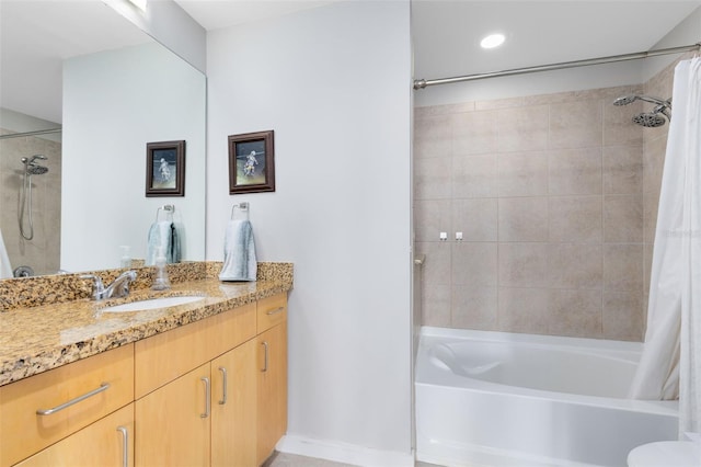 bathroom featuring vanity and shower / tub combo with curtain