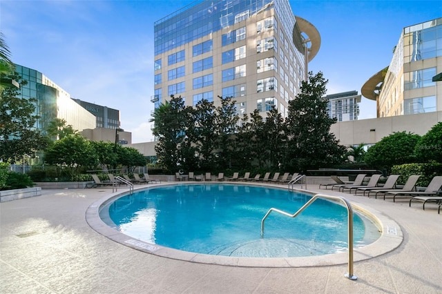 view of pool featuring a patio area