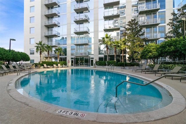 view of pool featuring a patio